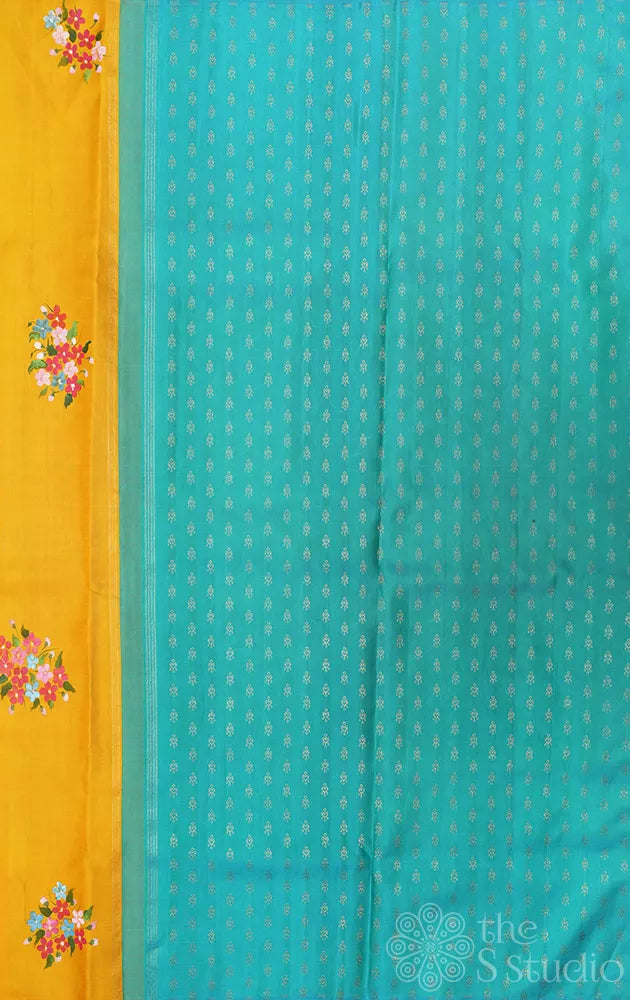 Mustard and aqua blue hand painted kanchipuram silk saree with party pallu