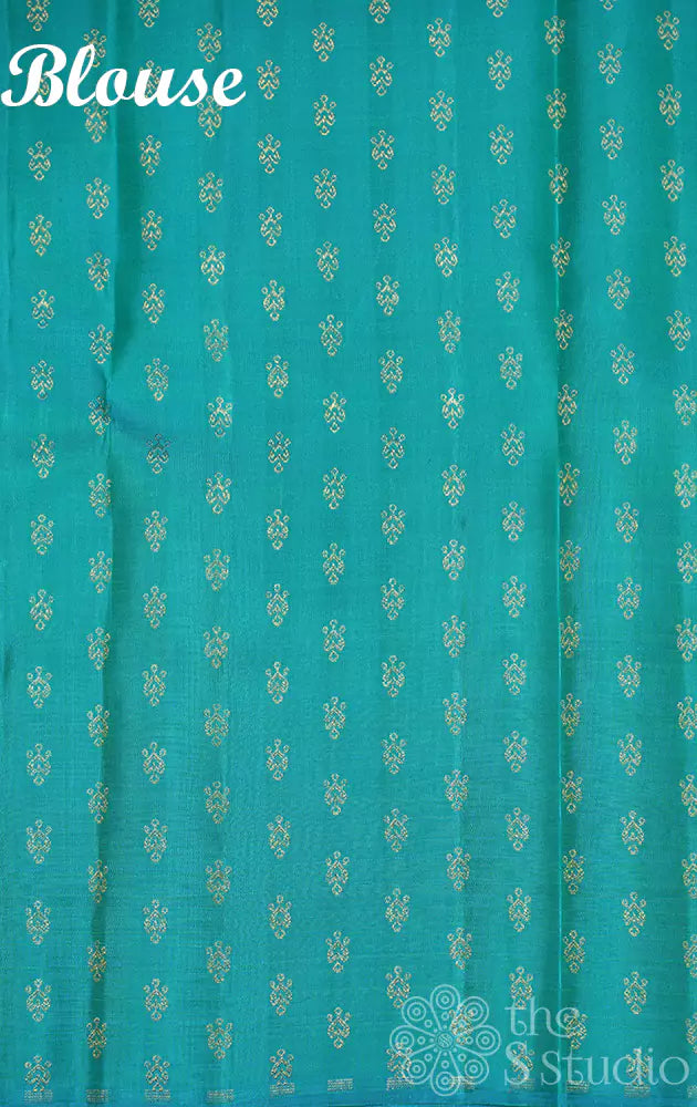 Mustard partly pallu kanjivaram saree with sea green buttas for pleats and pallu