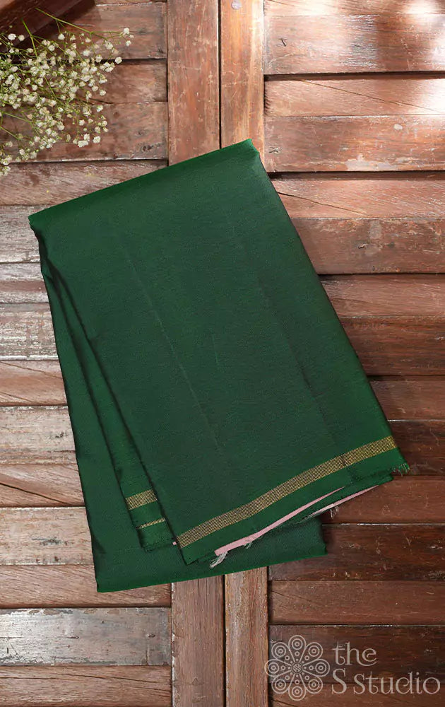 Bottle green plain kanchi silk saree with pink pallu 