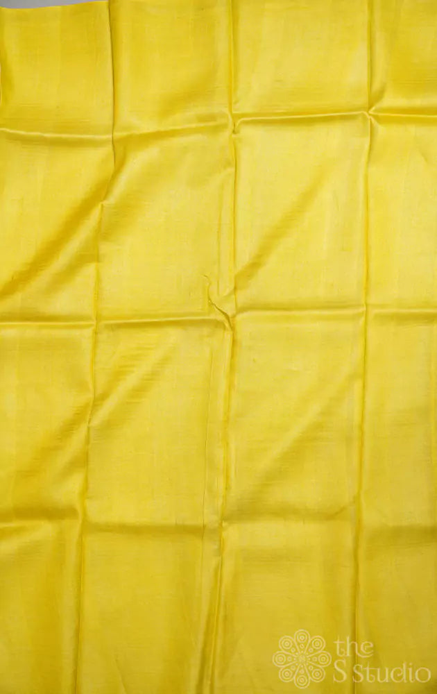 Off-white tussar silk saree with lemon yellow border