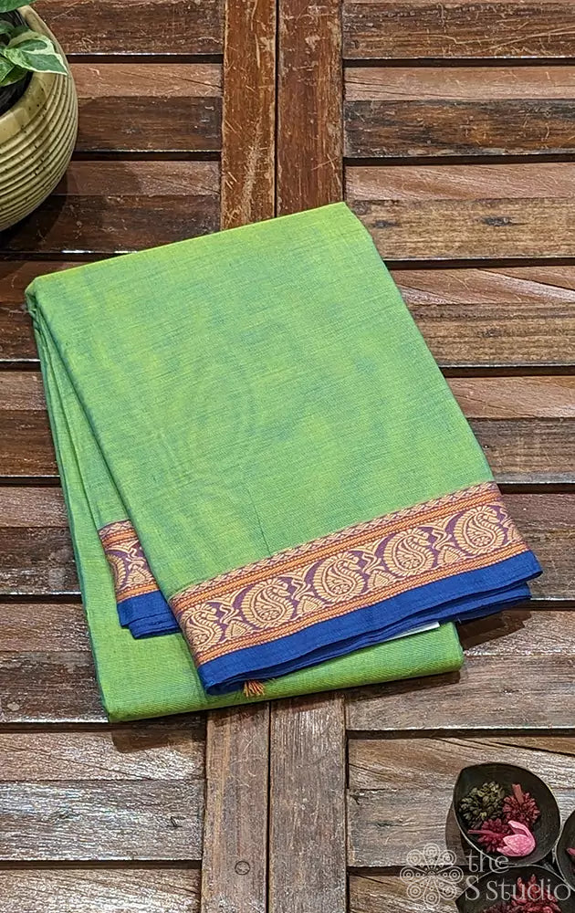 Light green kanchi cotton saree with blue selvedge