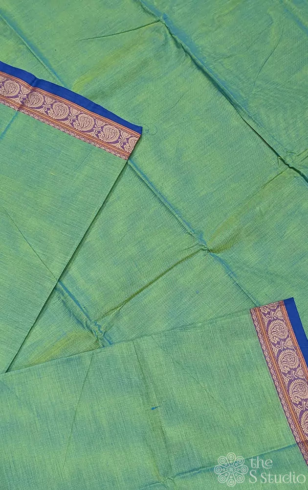 Light green kanchi cotton saree with blue selvedge