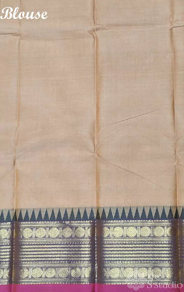 Beige kanchi cotton saree featuring temple border