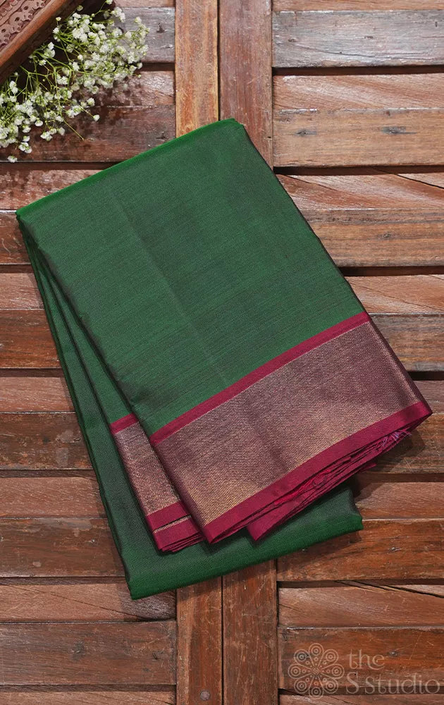 Green plain kanchipuram silk saree with maroon zari border