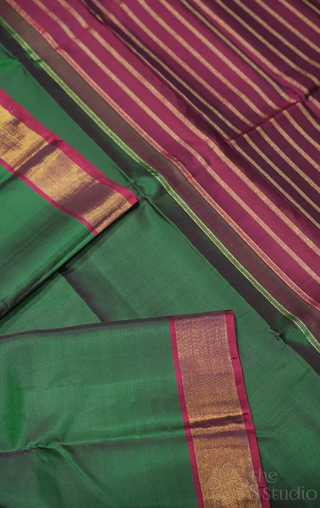 Green plain kanchipuram silk saree with maroon zari border