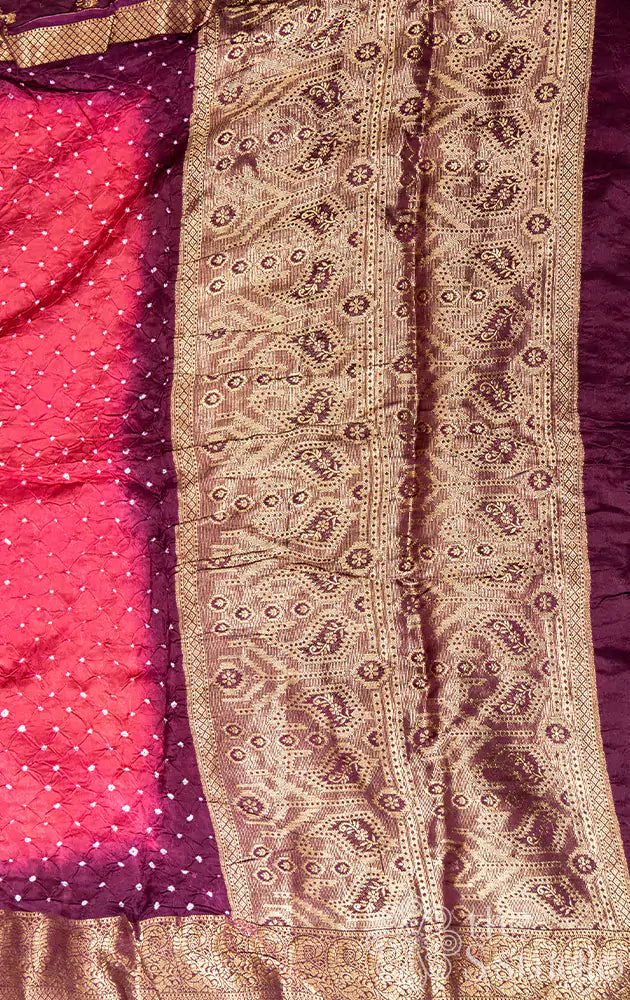 Salmon pink bandhini saree with purple pallu