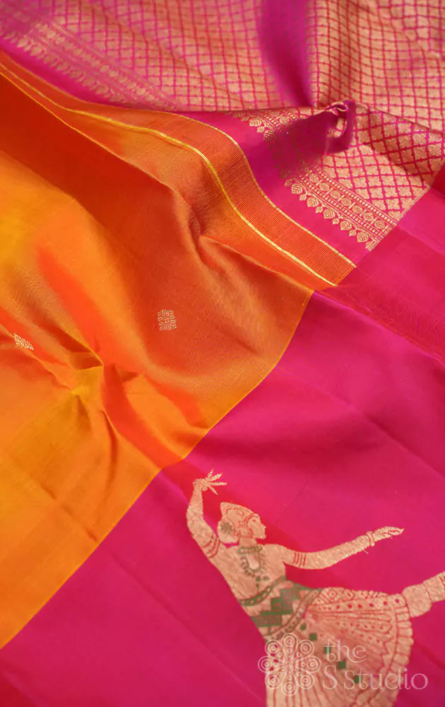 Mustard kanchi silk saree with rani pink dancing lady border