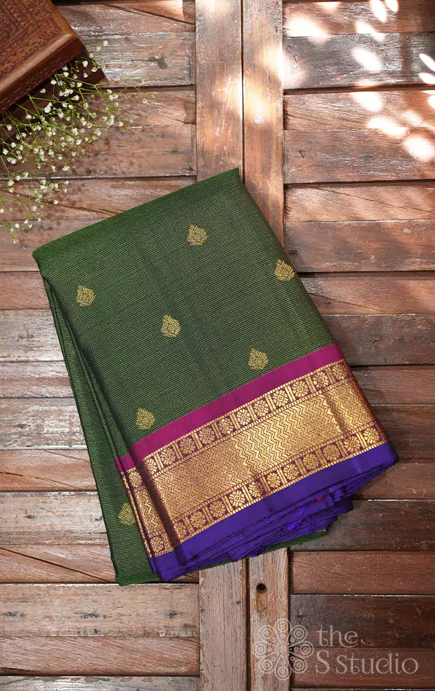 Emerald green vaira oosi kanchi silk saree with rani pink border