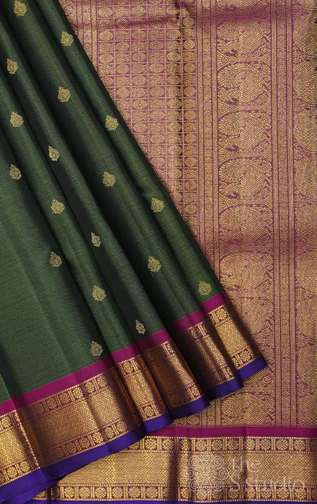 Emerald green vaira oosi kanchi silk saree with rani pink border