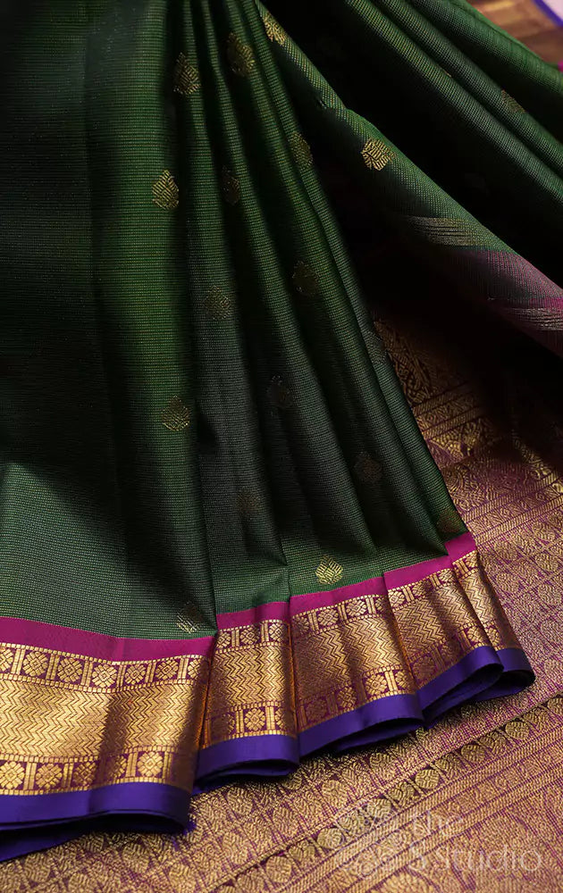 Emerald green vaira oosi kanchi silk saree with rani pink border