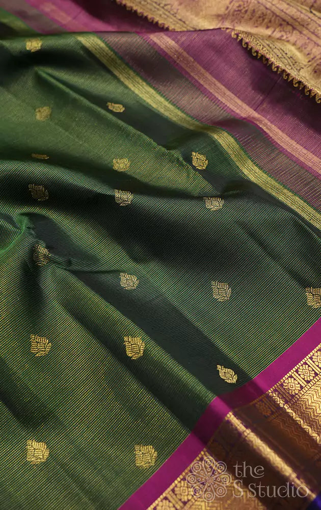 Emerald green vaira oosi kanchi silk saree with rani pink border