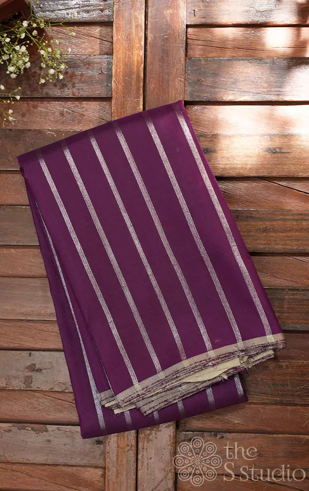 Deep purple kanchipuram silk saree with vertical silver zari lines and contrast pallu