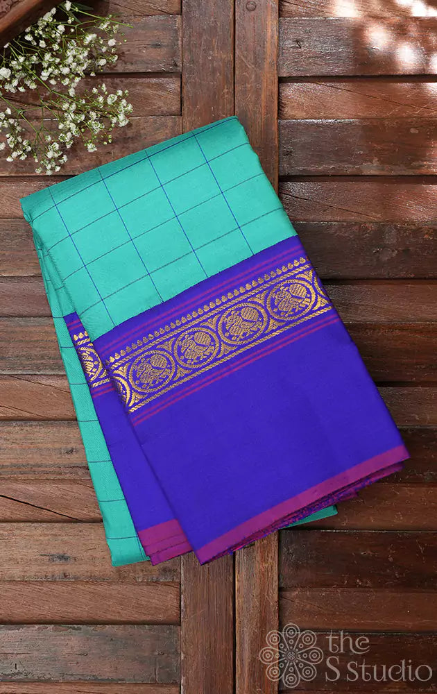 Sea green kanjivaram silk saree with royal blue border