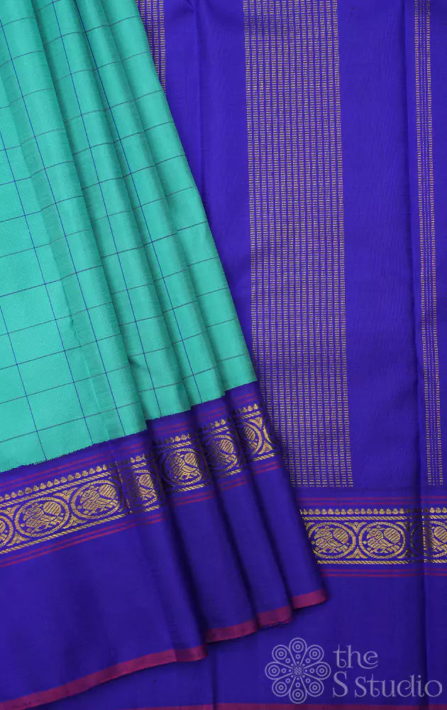 Sea green kanjivaram silk saree with royal blue border