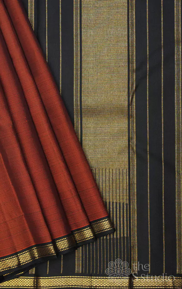 Rust kanjivaram saree with small black border