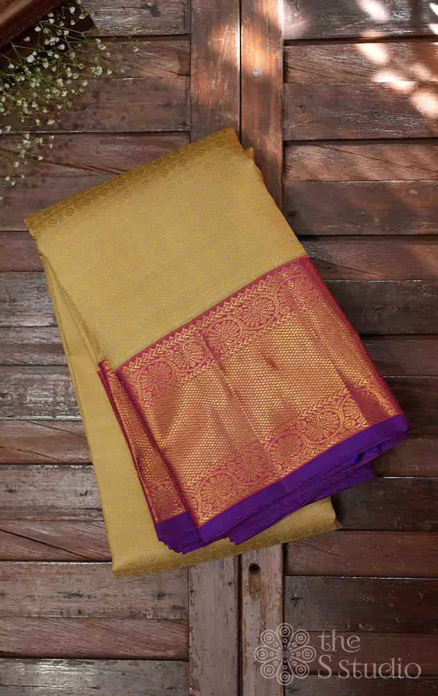 Golden beige kanjivaram silk saree with bright pink korvai border