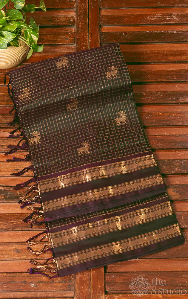 Dark green checked silkcotton saree with deer butta