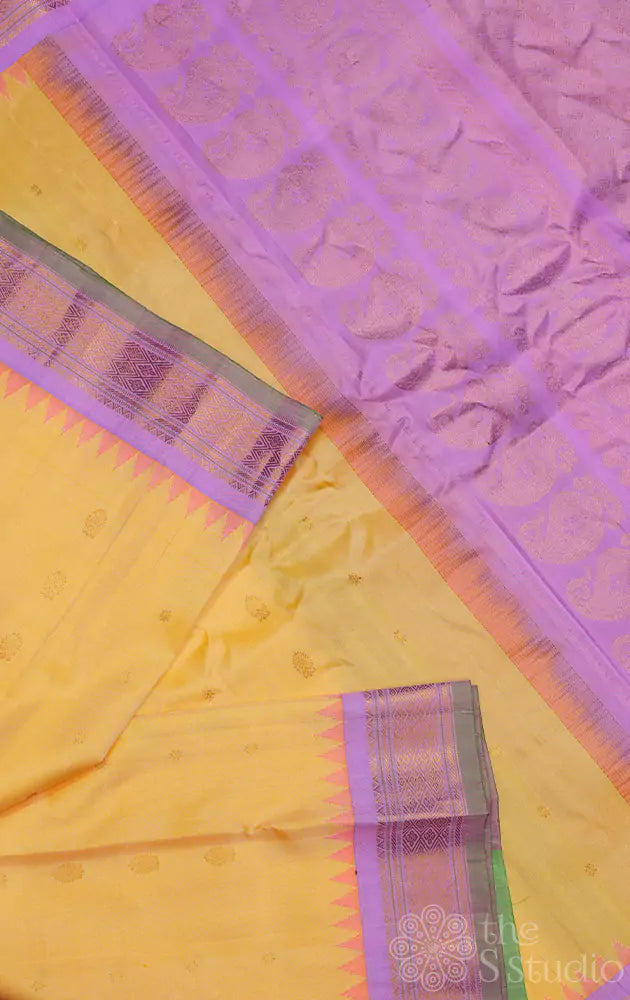 Yellow gadwal silk saree with lavender border