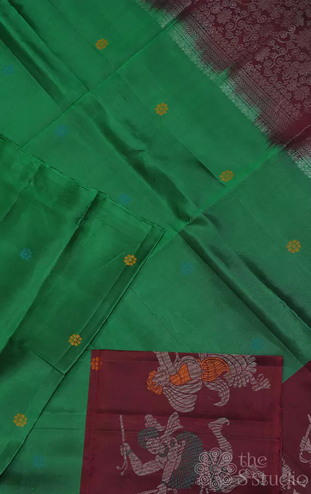 Green soft silk saree with dancing motifs brown border