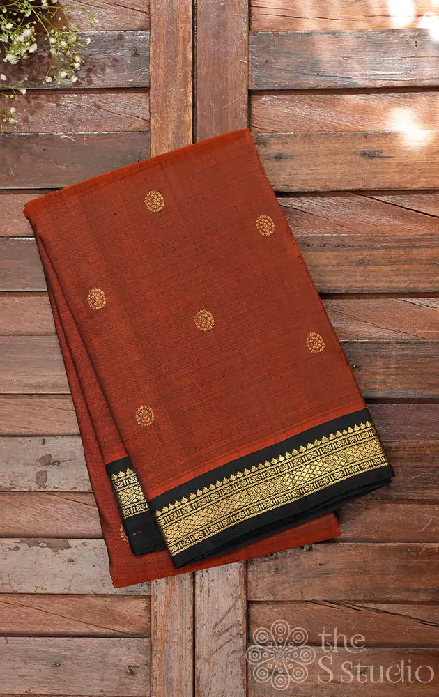 Rust kanjivaram saree with small black border