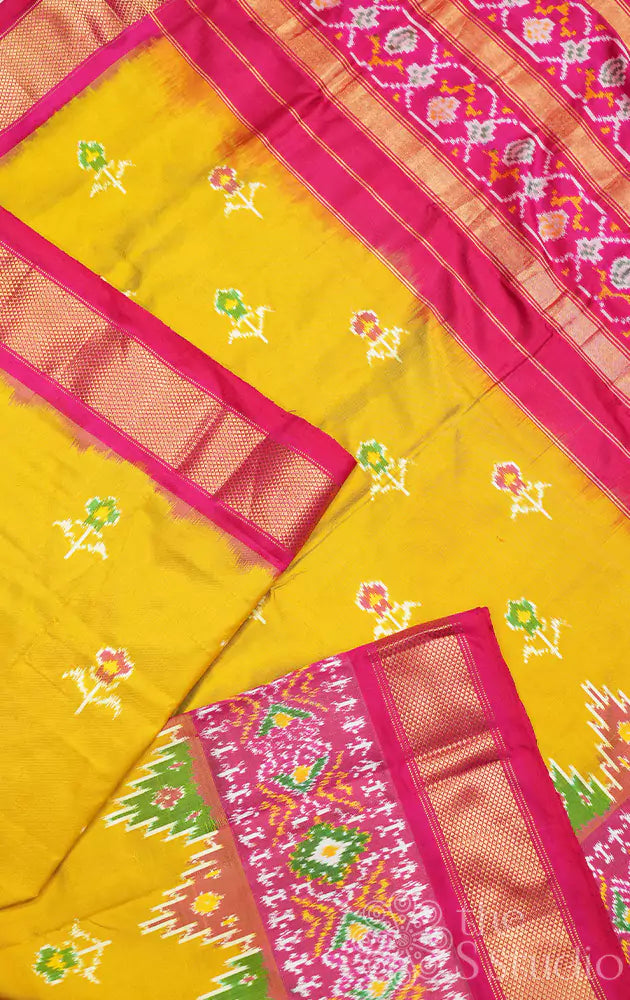 Mustard ikkat silk saree with rani pink zari border