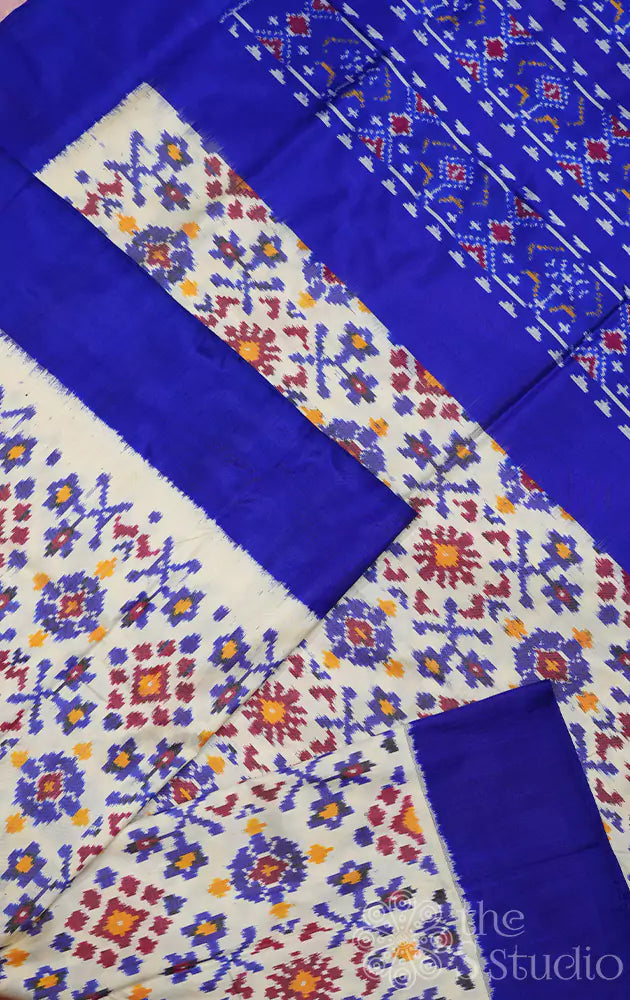 Off white ikkat silk saree with royal blue border