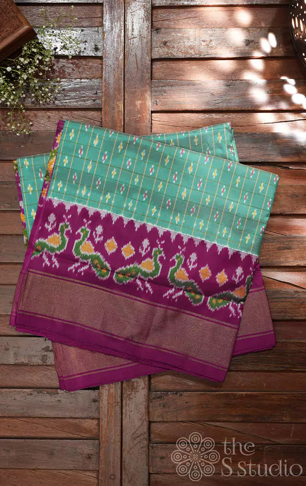 Sea green ikkat silk saree with purple border