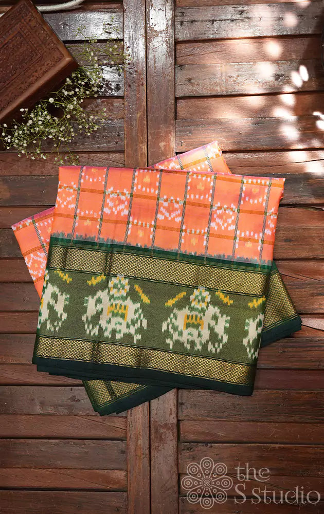 Peacish orange checked ikkat silk saree with dark green border