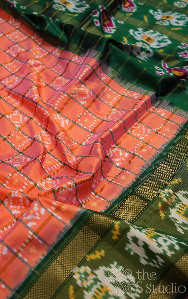 Peacish orange checked ikkat silk saree with dark green border