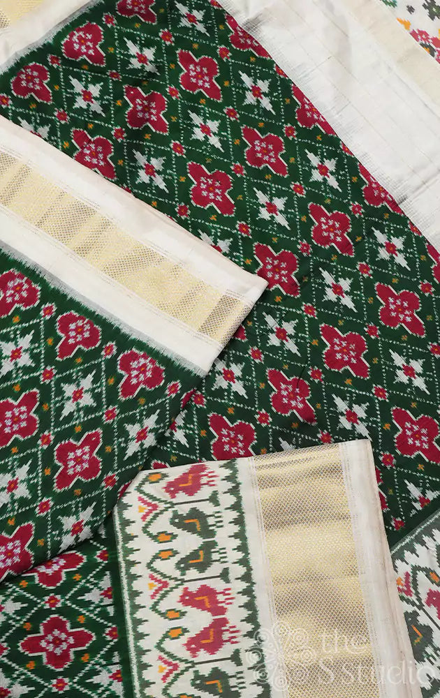 Dark green ikkat silk saree with offwhite border