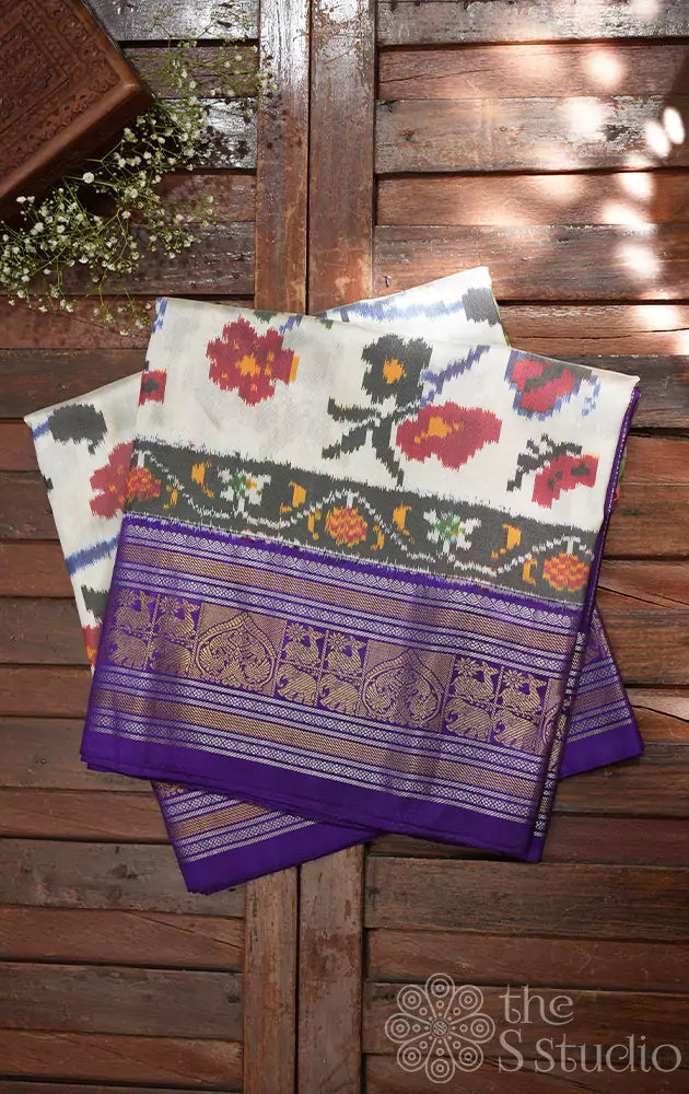 Offwhite ikkat silk saree with kanchi style violet border