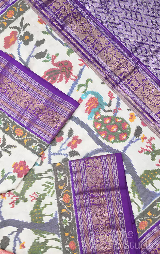 Offwhite ikkat silk saree with kanchi style violet border