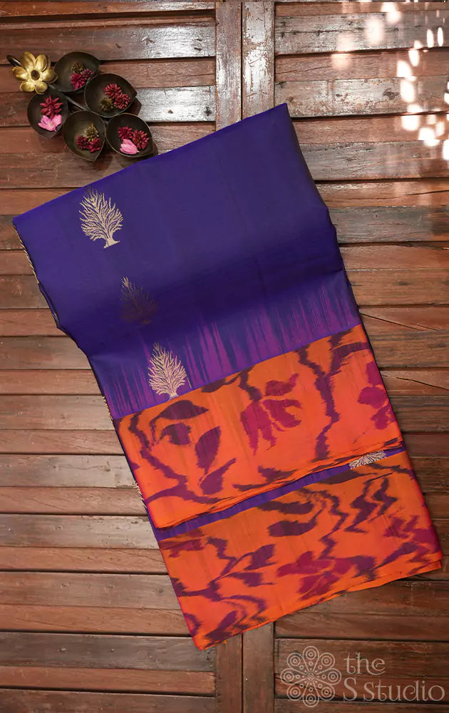 Navy blue soft silk saree with orange ikat woven border