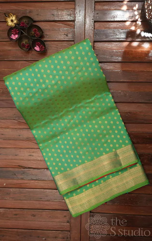 Parrot green soft silk saree with small butta