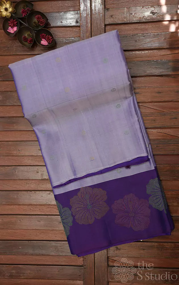 Lavender soft silk saree with violet hisbiscus zari woven border