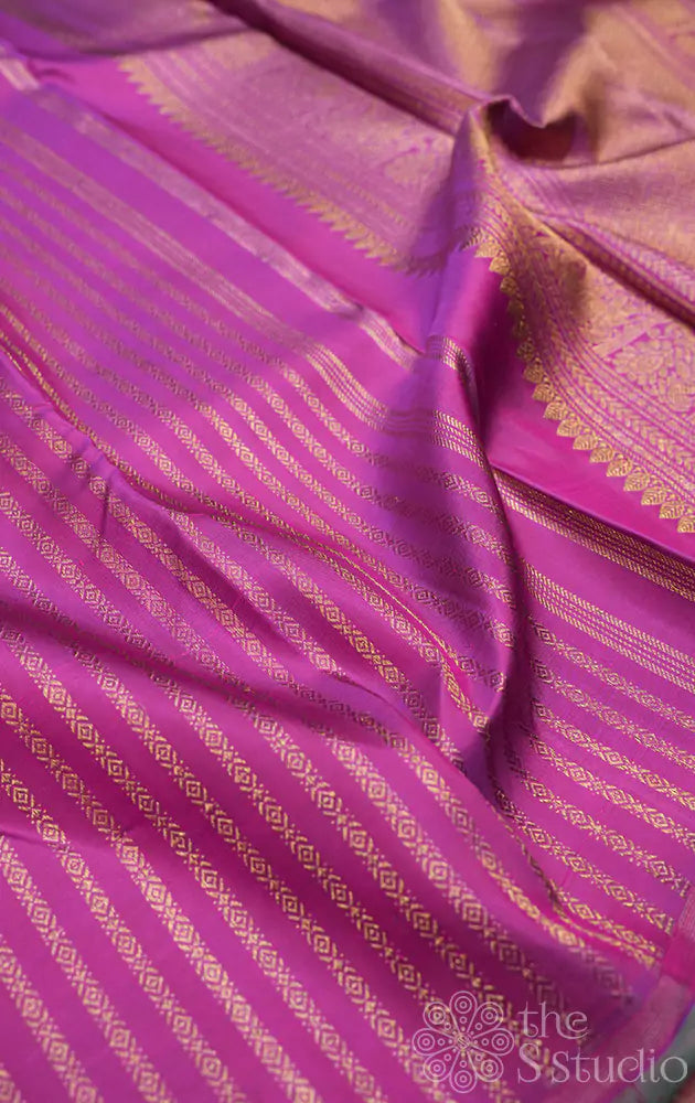 Magenta kanchipuram silk saree with vertical golden zari lines