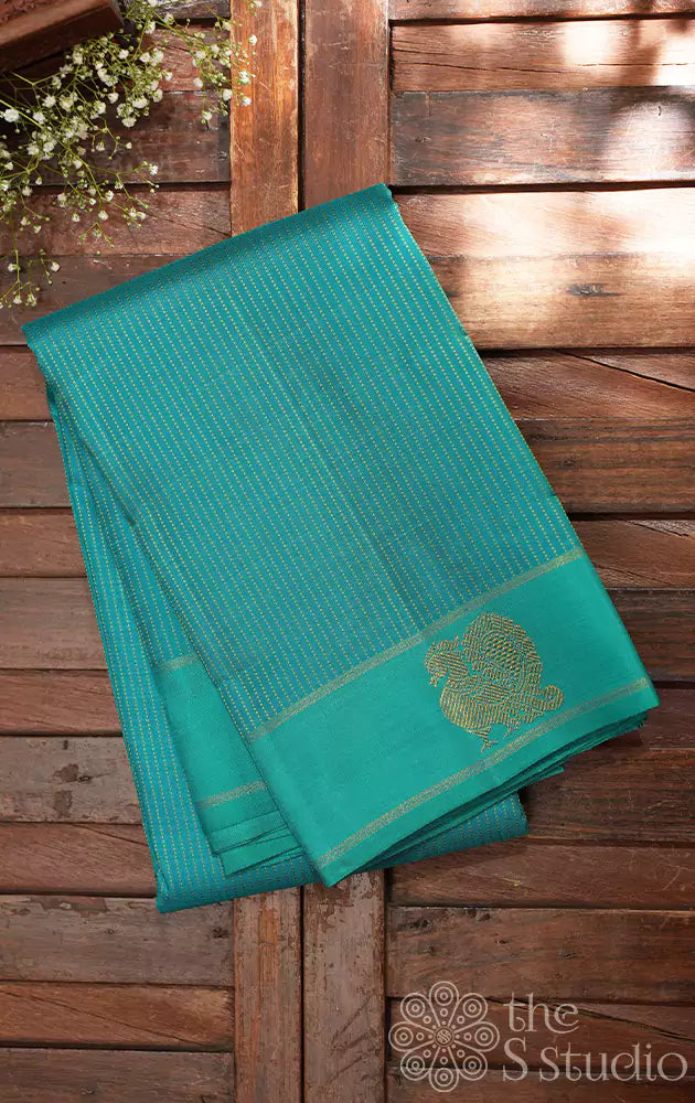 Sea green kanchi silk saree with long thread lines