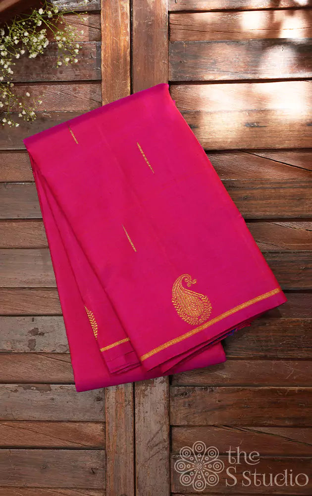 Rani pink kanchi silk saree with paisley zari motifs along the border