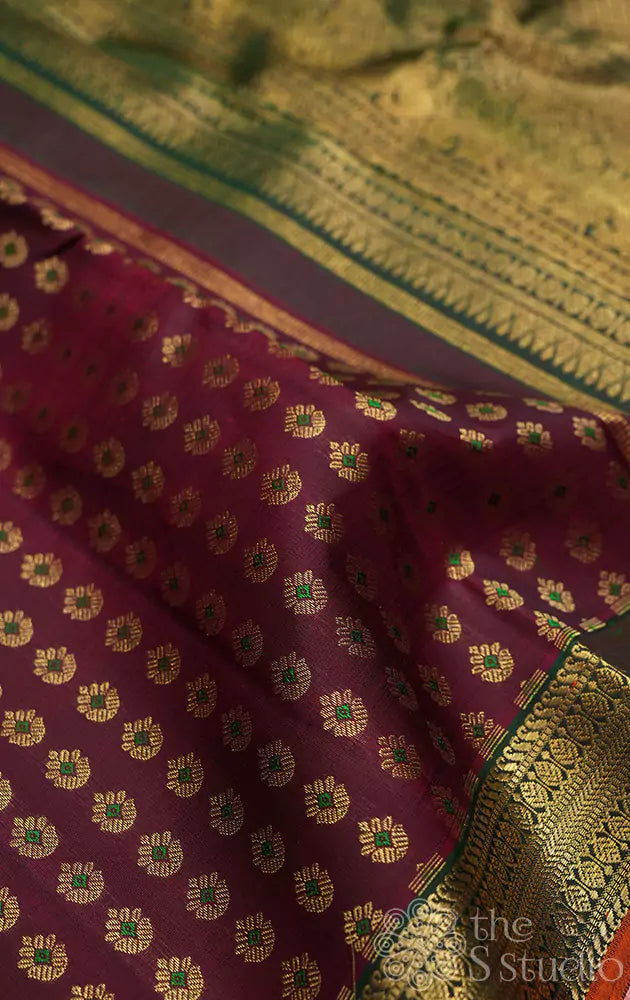 Maroon kanjivaram silk saree with small zari buttas and green border