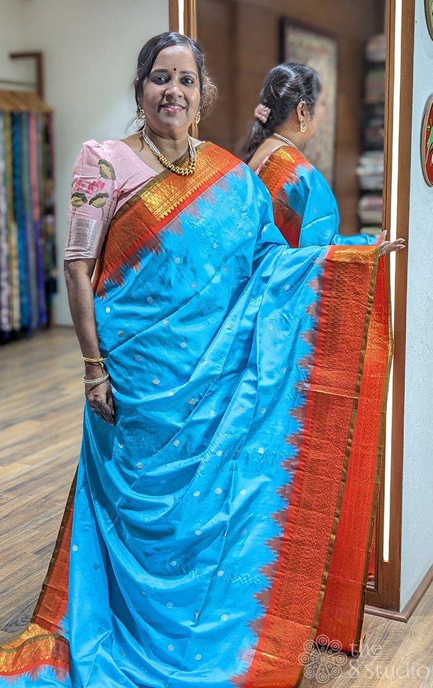 Blue gadwal silk saree with red border