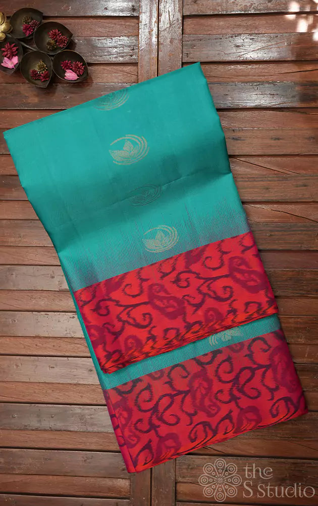 Sea green soft silk saree with peach ikkat woven border