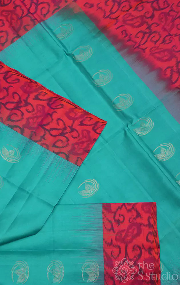 Sea green soft silk saree with peach ikkat woven border