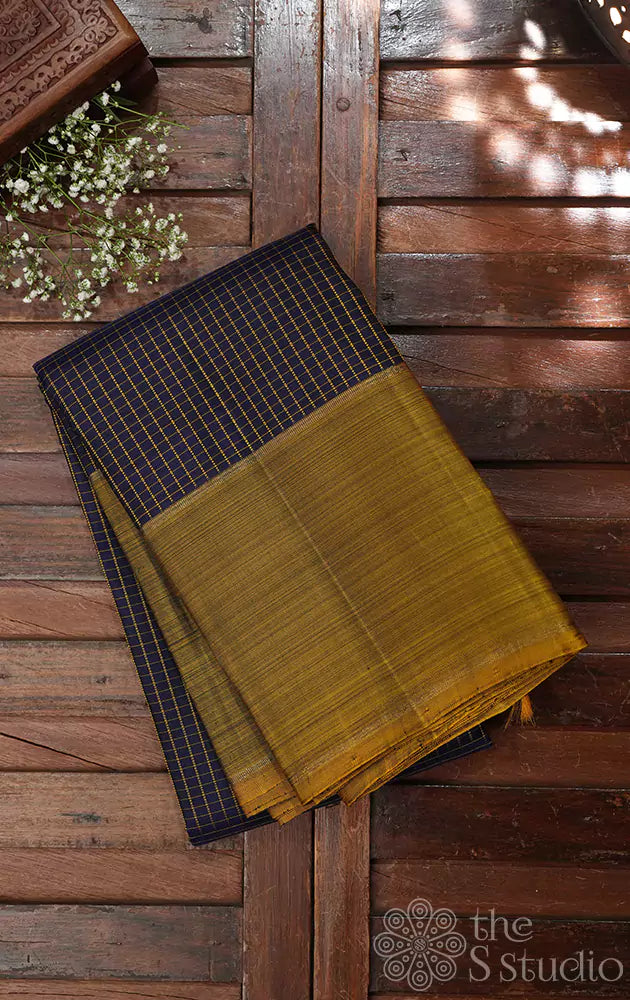 Navy blue checked kanchi silk saree with methi green border