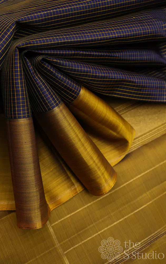 Navy blue checked kanchi silk saree with methi green border