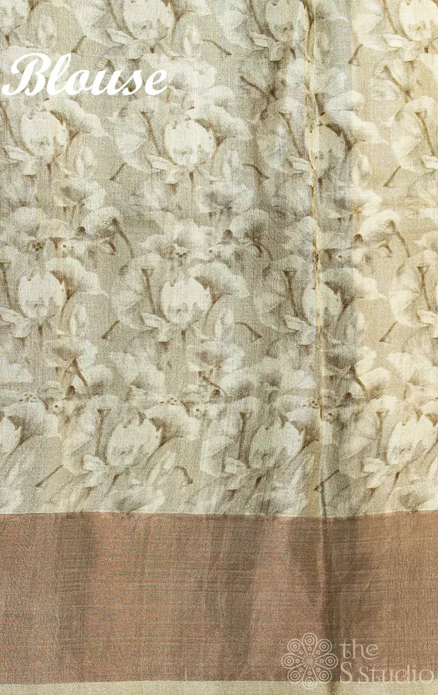 Light yellow tussar silk saree with floral prints and contrast pallu