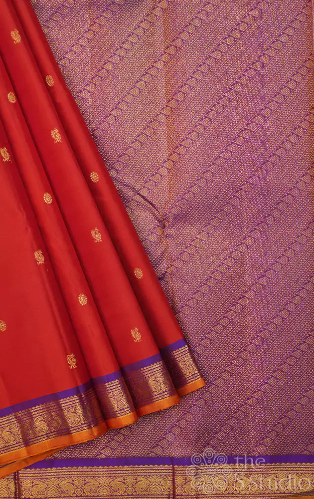 Rust kanchipuram silk saree with purple pallu