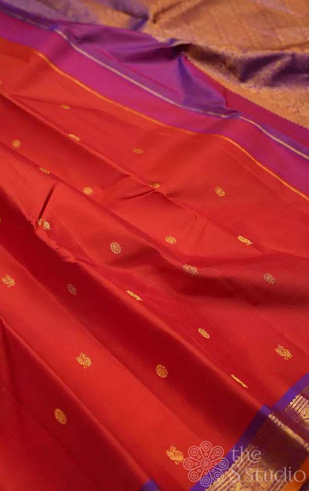 Rust kanchipuram silk saree with purple pallu