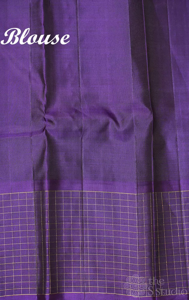 Rust kanchi pattu saree with violet checked border