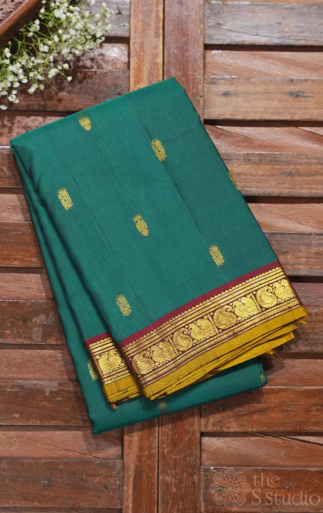 Emerald green kanchipuram silk saree with small zari border