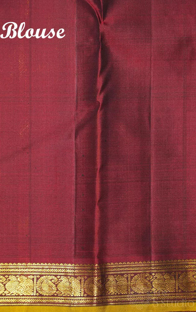 Emerald green kanchipuram silk saree with small zari border